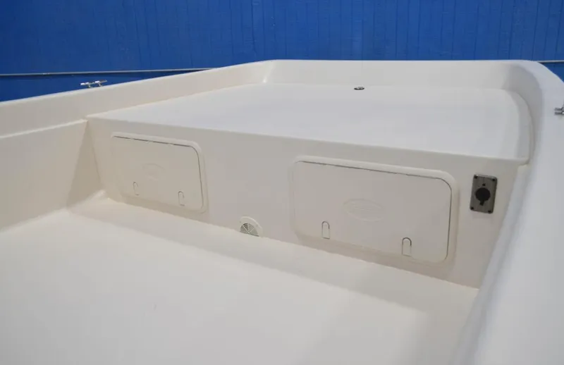 Slide: The Image of 2024 Carolina Skiff E24 DLX TH boat storage compartments. - 1