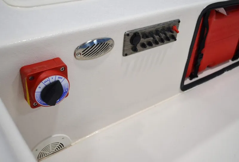 Slide: The Image of Control panel of 2024 Carolina Skiff E24 DLX TH boat with switches and dials. - 4