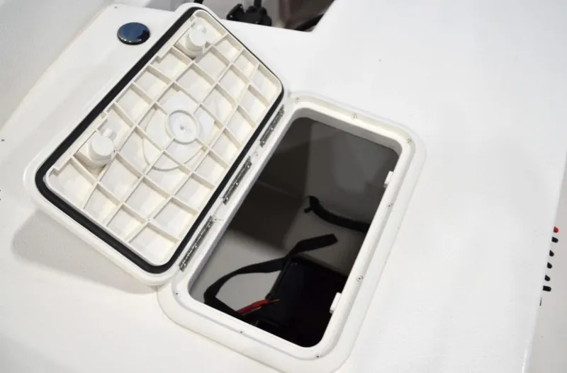 Slide: The Image of Open storage compartment on 2024 Carolina Skiff E24 DLX TH boat. - 5