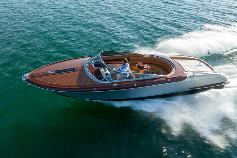 Slide: The Image of 2020 Riva Aquariva Super luxury speedboat cruising on open water. - 4