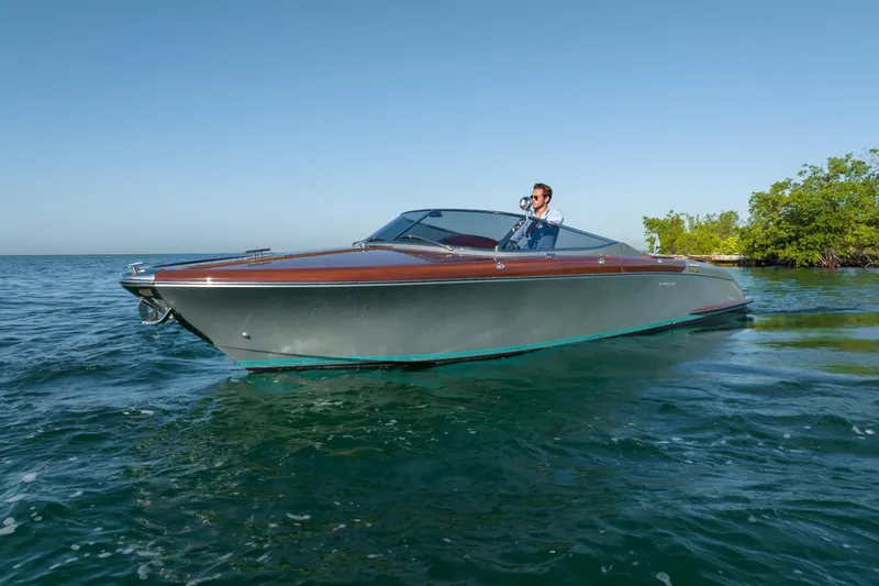 Slide: The Image of 2020 Riva Aquariva Super luxury boat cruising on clear blue water. - 6