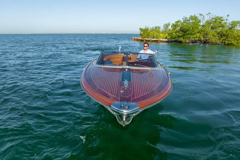 Slide: The Image of 2020 Riva Aquariva Super boat cruising on clear blue water. - 7