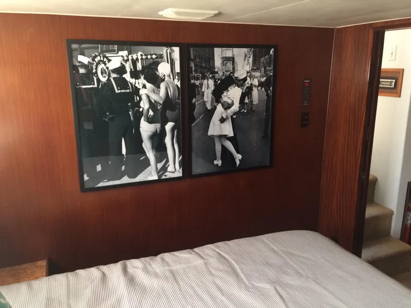 Slide: The Image of Interior of 1989 Hatteras 70 Cockpit Motor Yacht with vintage black-and-white wall art. - 19