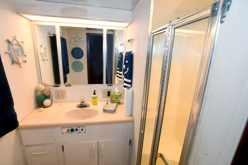 Slide: The Image of Bathroom interior of 1989 Hatteras 70 Cockpit Motor Yacht with shower and vanity. - 23