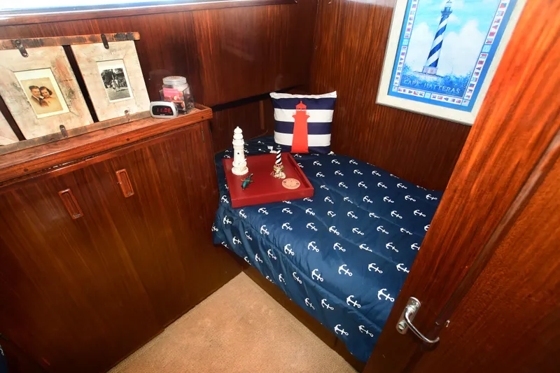 Slide: The Image of Cozy cabin interior of 1989 Hatteras 70 Cockpit Motor Yacht with nautical decor. - 25