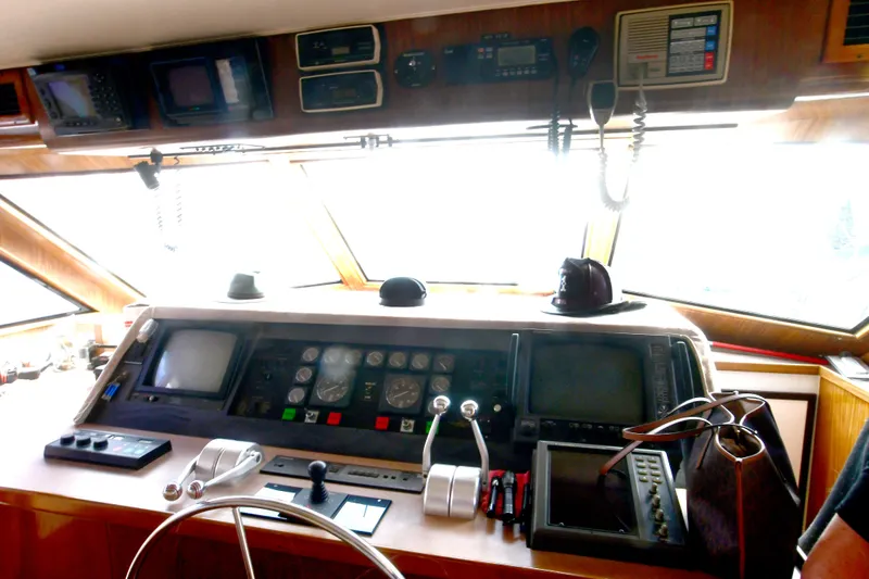 Slide: The Image of Cockpit of 1989 Hatteras 70 Motor Yacht with navigation instruments and controls. - 26