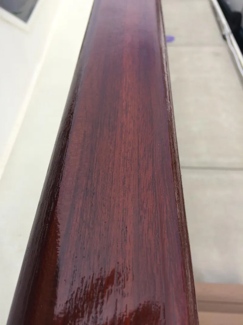 Slide: The Image of Polished wooden railing on a 1989 Hatteras 70 Cockpit Motor Yacht. - 31