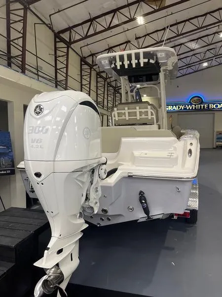 Slide: The Image of 2025 Key West 239 FS boat with powerful outboard motor in showroom. - 8