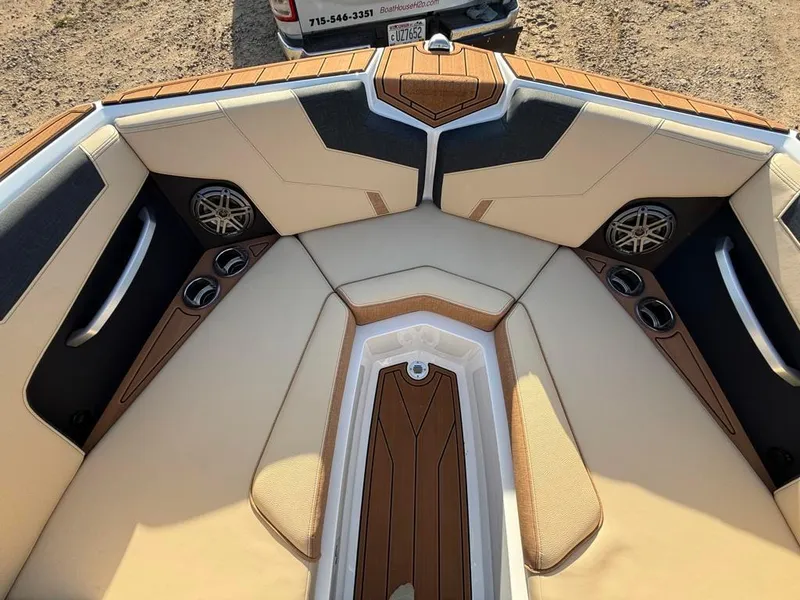 Slide: The Image of 2025 Nautique Super Air GS22 boat interior with premium seating and speakers. - 12