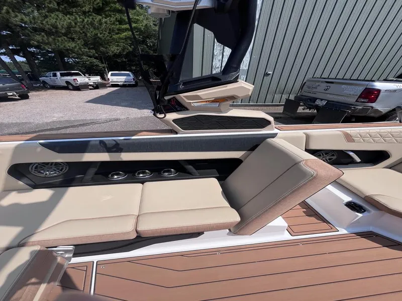 Slide: The Image of 2025 Nautique Super Air GS22 interior with beige seating and modern design. - 24