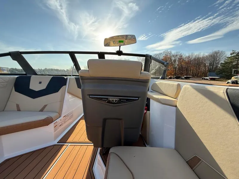 Slide: The Image of 2025 Nautique Super Air GS22 interior with modern seating and sleek design. - 28