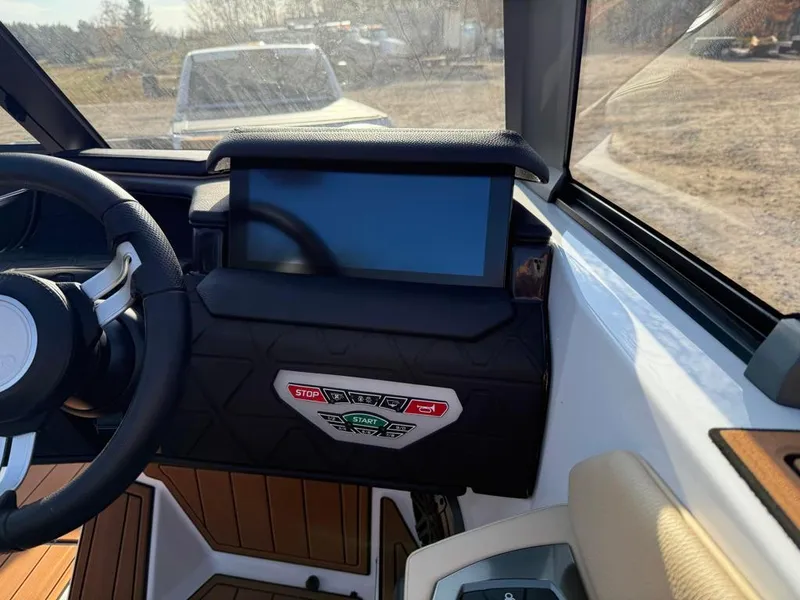 Slide: The Image of 2025 Nautique Super Air GS22 dashboard with touchscreen and control panel. - 33