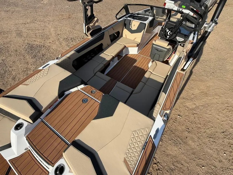 Slide: The Image of 2025 Nautique Super Air GS22 boat interior with tan and wood accents. - 39