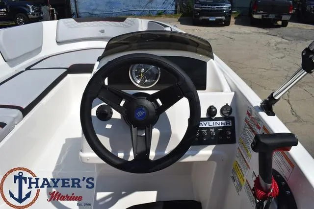 Slide: The Image of 2024 Bayliner M15 boat dashboard and steering wheel at Thayer's Marine. - 10