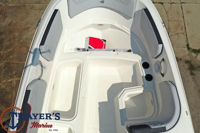 Slide: The Image of 2024 Bayliner M15 boat interior, spacious seating, and storage compartments. - 21