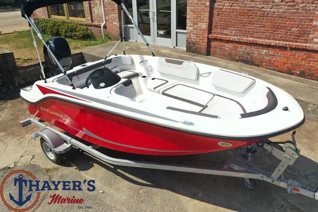 Slide: The Image of 2024 Bayliner M15 boat in red and white on a trailer at Thayer's Marine. - 4