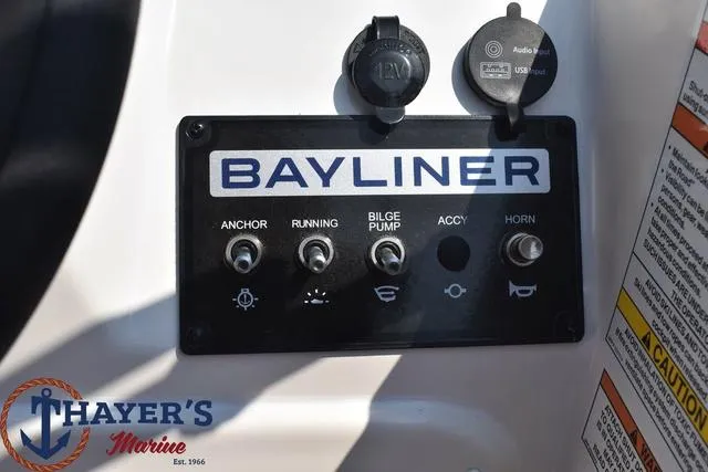 Slide: The Image of Control panel of 2024 Bayliner M15 boat with switches and USB port. - 6