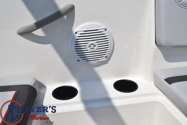 Slide: The Image of 2024 Bayliner M15 boat interior with speaker and cup holders. - 9