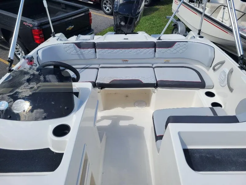 Slide: The Image of 2024 Bayliner M17 boat interior with seating and steering console. - 7