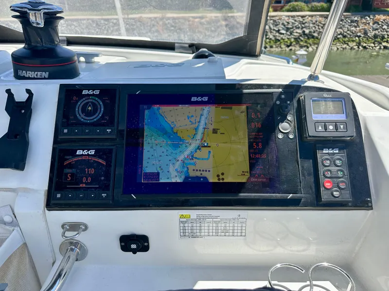 Slide: The Image of 2020 Lagoon 40 catamaran cockpit with helm, seating, and navigation equipment. - 21