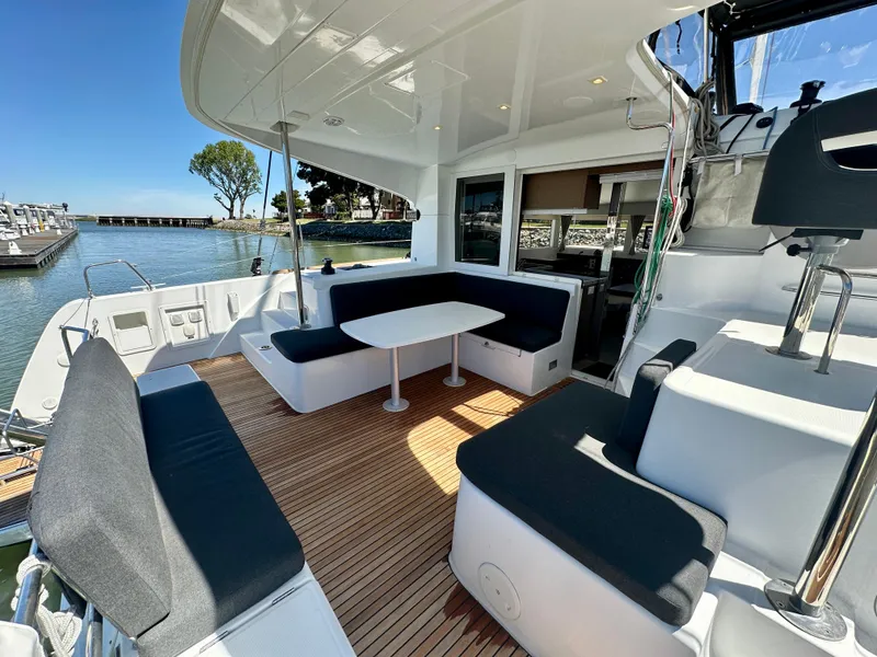 Slide: The Image of Spacious deck of 2020 Lagoon 40 catamaran with comfortable seating and table. - 26