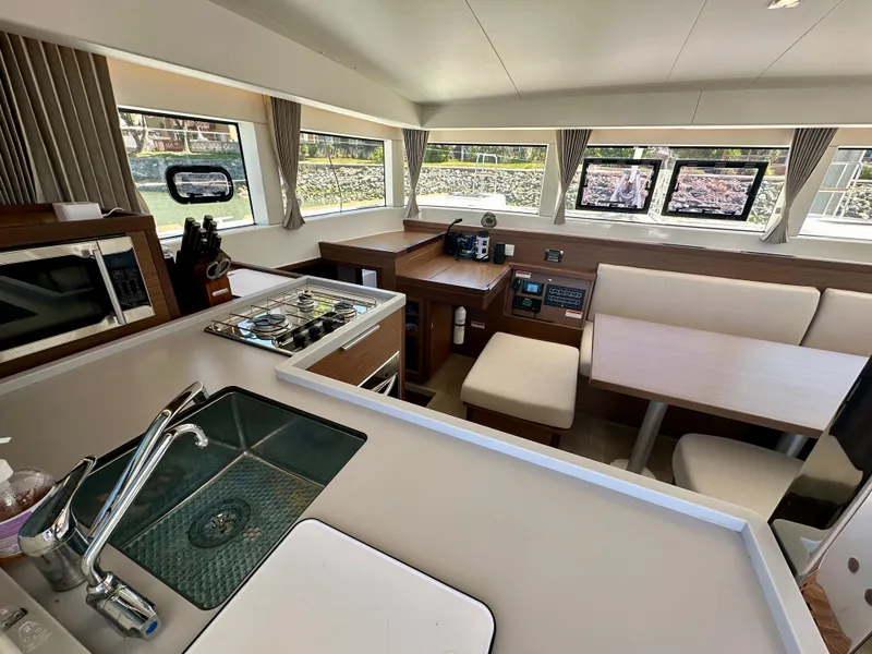 Slide: The Image of Modern interior of 2020 Lagoon 40 catamaran with spacious seating and large windows. - 38