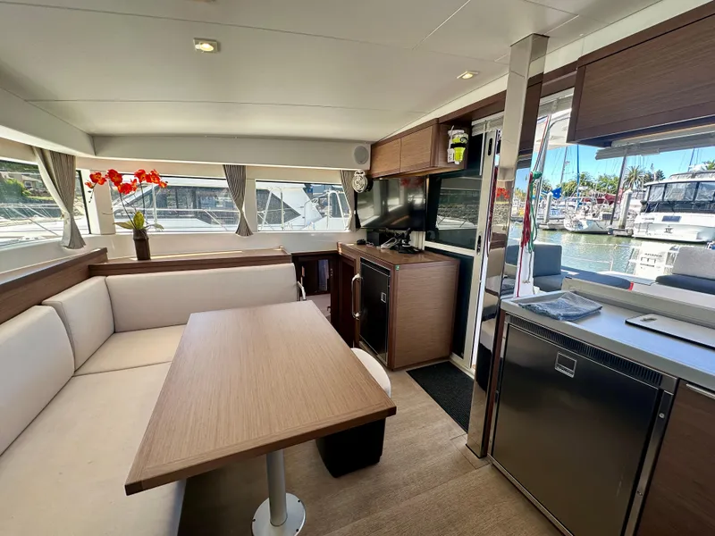 Slide: The Image of Interior of 2020 Lagoon 40 catamaran with modern kitchen and marina view. - 46