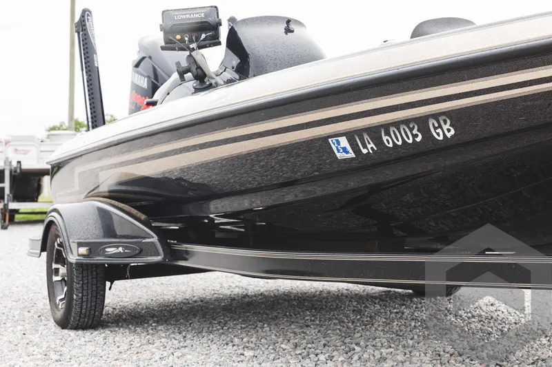 Slide: The Image of 2009 Skeeter ZX 200 boat on a trailer, side view with registration number. - 11