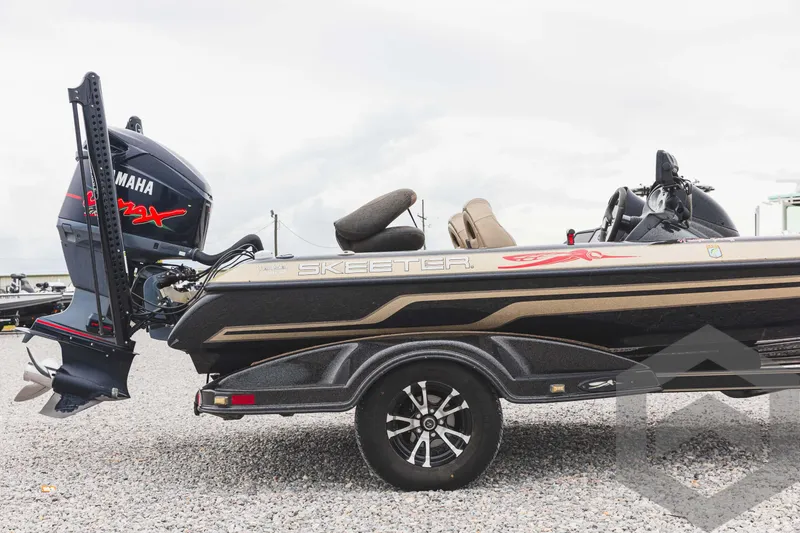 Slide: The Image of 2009 Skeeter ZX 200 boat with Yamaha engine on trailer. - 13