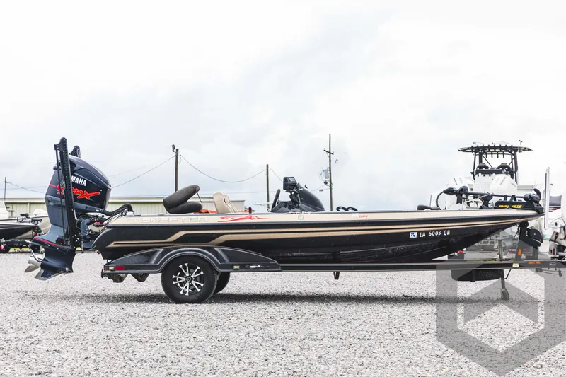 Slide: The Image of 2009 Skeeter ZX 200 bass boat with Yamaha outboard motor on trailer. - 4