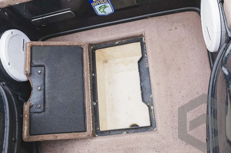 Slide: The Image of 2009 Skeeter ZX 200 boat storage compartment with open hatch and Bass sticker. - 40