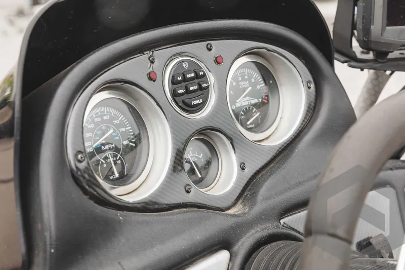 Slide: The Image of 2009 Skeeter ZX 200 boat dashboard with speedometer, tachometer, and fuel gauge. - 45