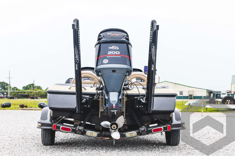 Slide: The Image of 2009 Skeeter ZX 200 boat rear view with motor and trailer. - 6