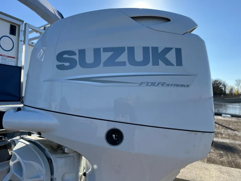 Slide: The Image of Suzuki four-stroke outboard motor on a 2022 Nepallo CW18 boat. - 10