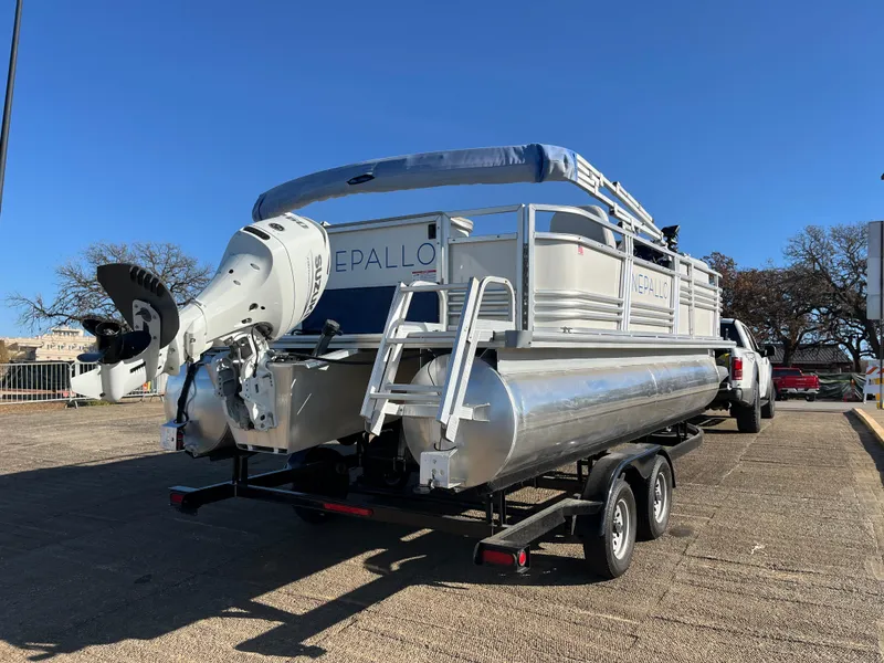 Slide: The Image of 2022 Nepallo CW18 pontoon boat on trailer, parked outdoors. - 18