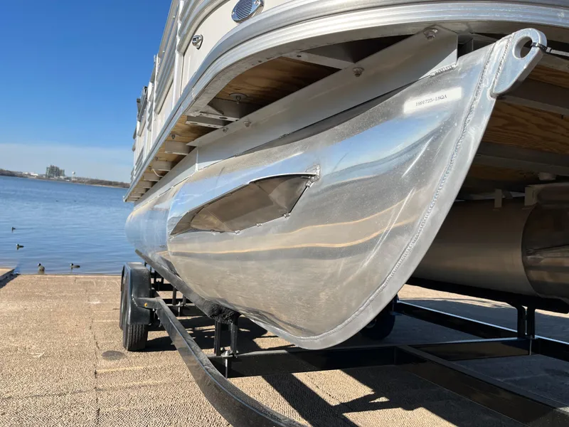 Slide: The Image of 2022 Nepallo CW18 boat on trailer by the lake, showcasing sleek aluminum hull design. - 23