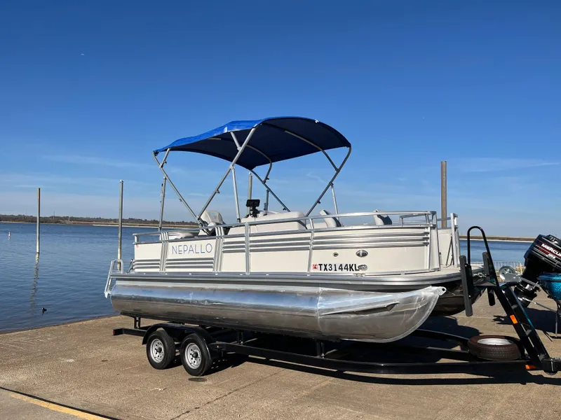 Slide: The Image of 2022 Nepallo CW18 pontoon boat on trailer by the lake. - 26