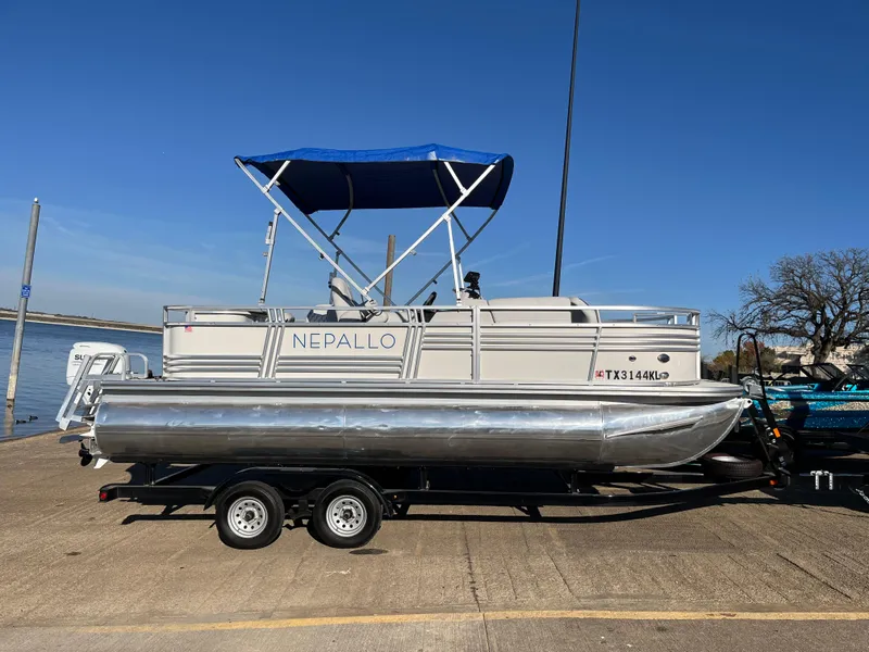 Slide: The Image of 2022 Nepallo CW18 pontoon boat on trailer with blue canopy. - 27
