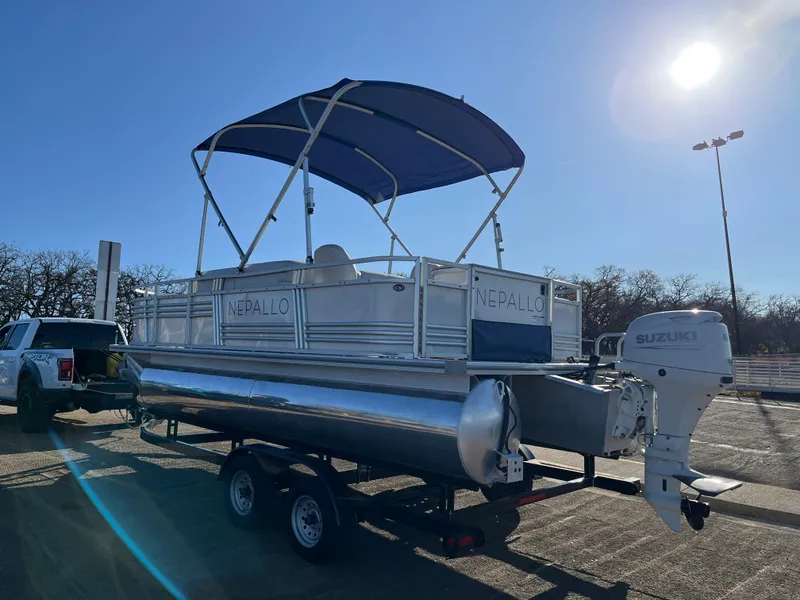 Slide: The Image of Nepallo CW18 pontoon boat, 2022 model, with Suzuki outboard motor on trailer. - 29