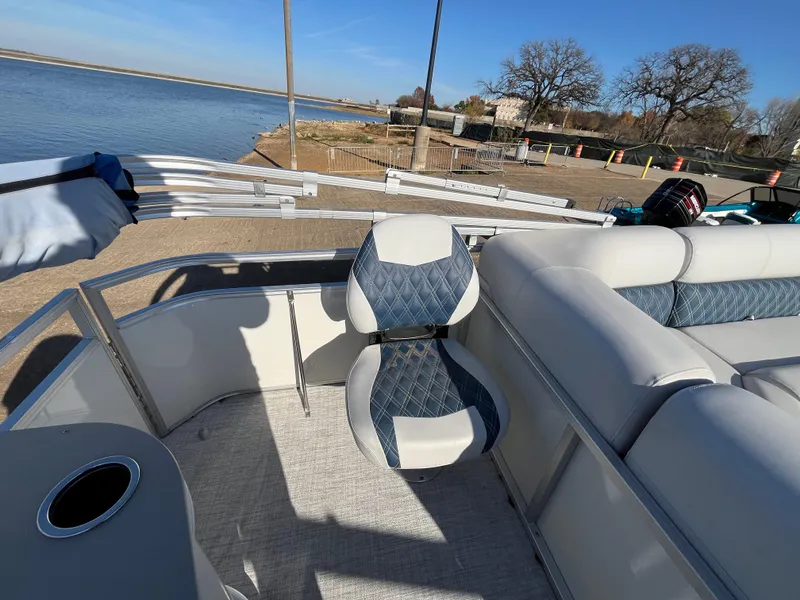 Slide: The Image of Nepallo CW18 boat interior, 2022 model, featuring blue and white seating by a serene lake. - 41