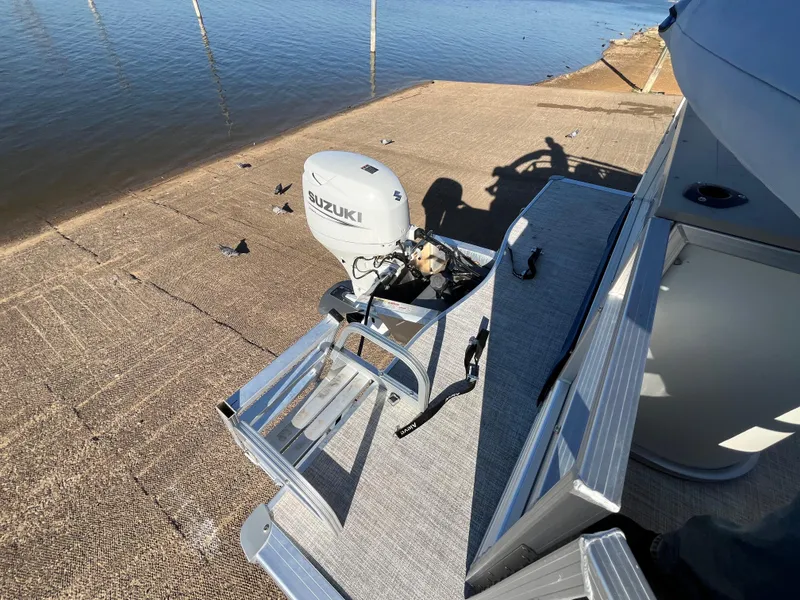 Slide: The Image of Nepallo CW18 boat with Suzuki outboard motor on a dock, 2022 model. - 44