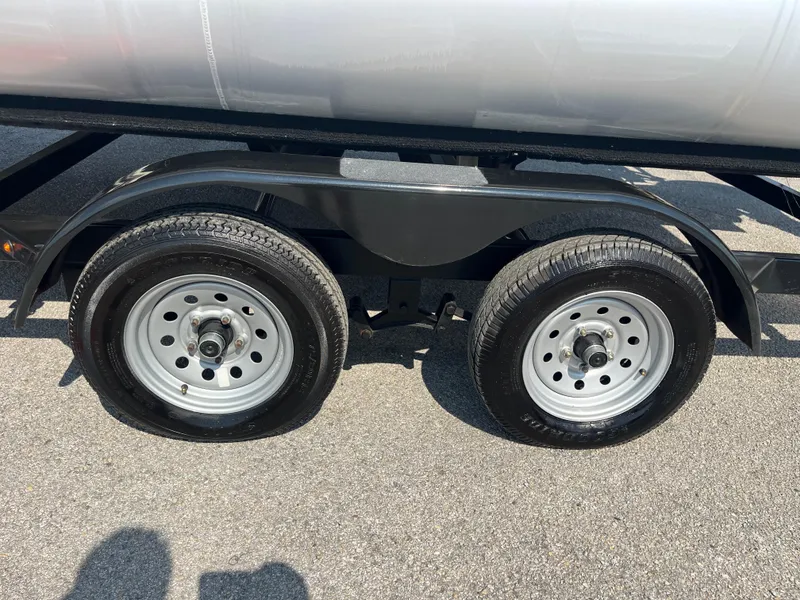Slide: The Image of Dual wheels of a 2022 Nepallo CW18 trailer on asphalt. - 48