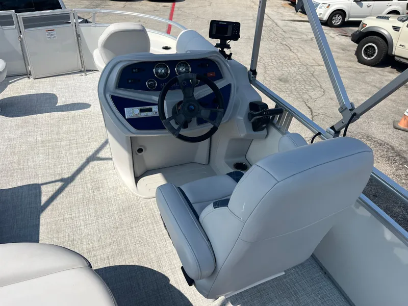 Slide: The Image of 2022 Nepallo CW18 boat cockpit with steering wheel and controls. - 50