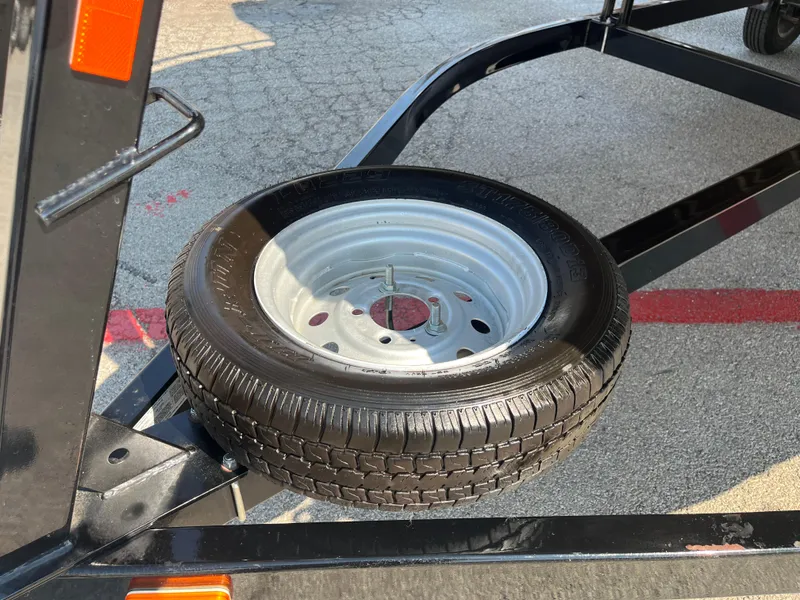 Slide: The Image of Spare tire mounted on a 2022 Nepallo CW18 trailer frame. - 53