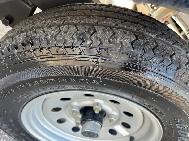 Slide: The Image of Close-up of a 2022 Nepallo CW18 tire with radial tread pattern. - 54