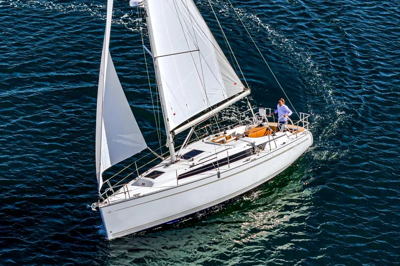 Slide: The Image of 2024 Bavaria Cruiser 34 sailing on open water. - 1