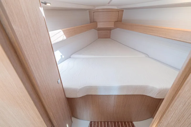 Slide: The Image of 2024 Bavaria Cruiser 34 forward cabin with a spacious double bed. - 41