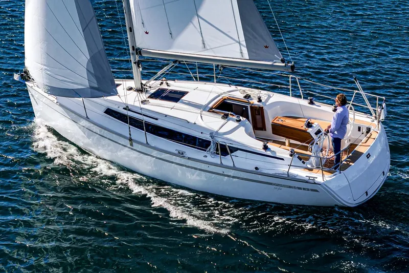 Slide: The Image of 2024 Bavaria Cruiser 34 sailing on open water. - 6
