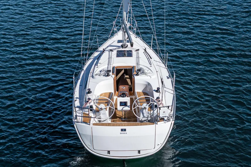 Slide: The Image of 2024 Bavaria Cruiser 34 sailboat on open water. - 9