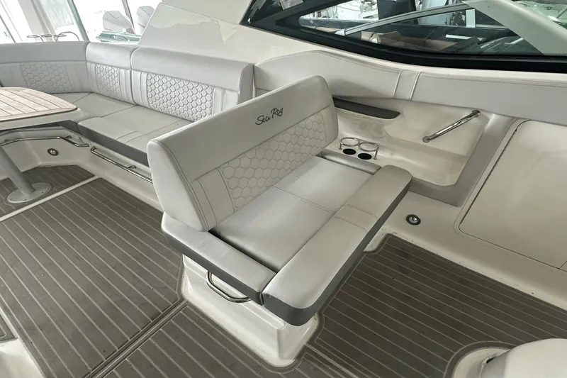 Slide: The Image of 2025 Sea Ray Sundancer 320 interior with luxurious seating and modern design. - 16
